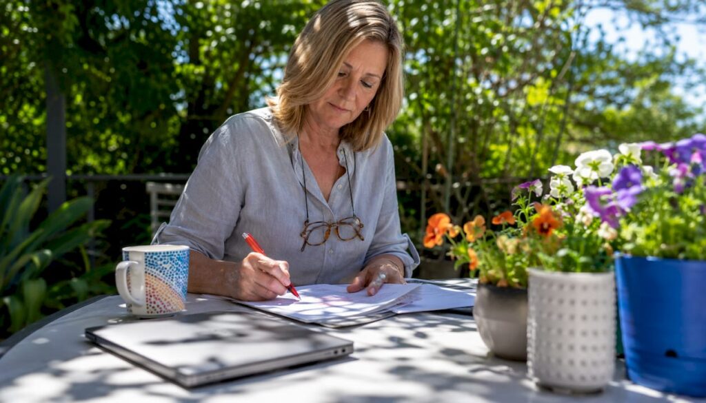 Woman highlighting website copy drafts at home office