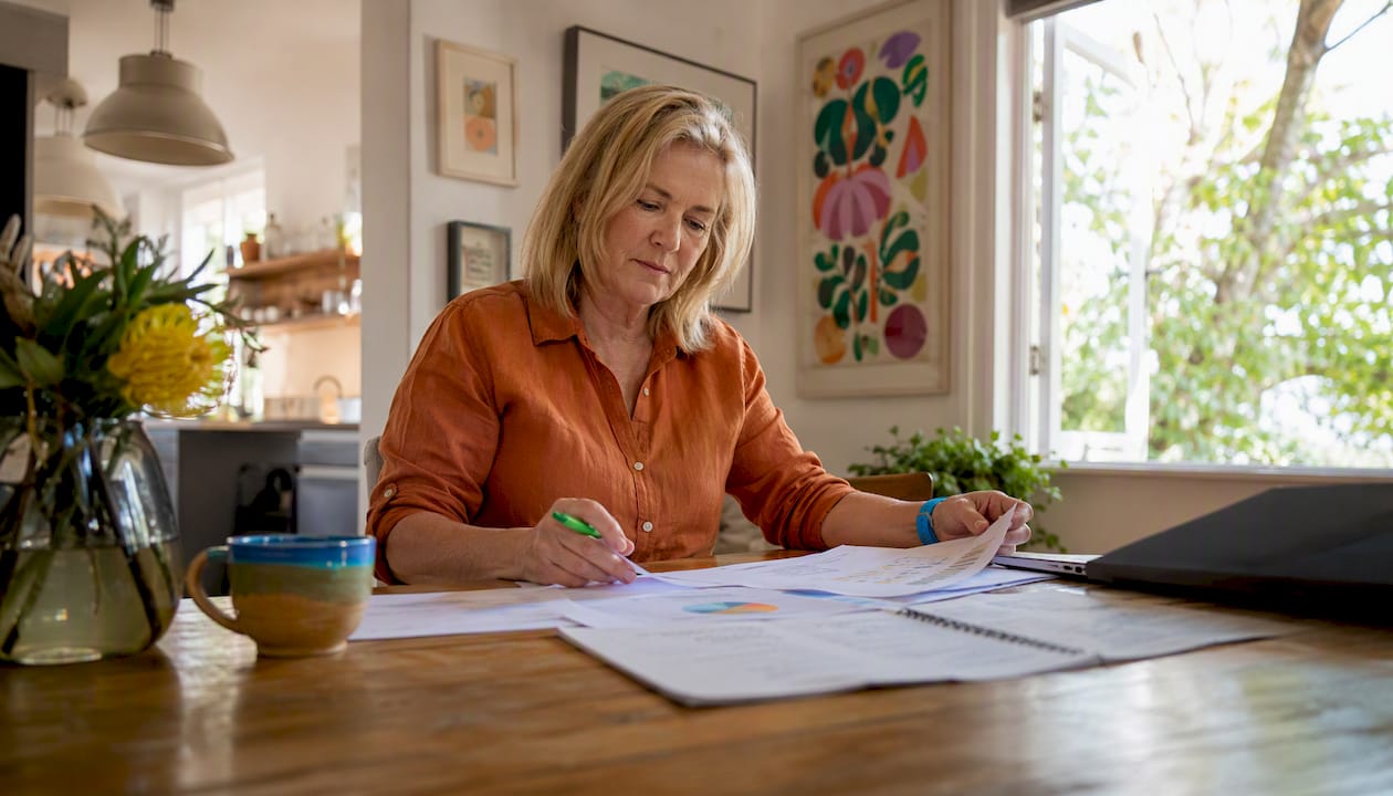 Small business owner reviewing website analytics at home