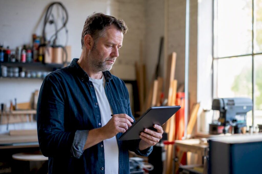 Service business owner reviewing leads on tablet