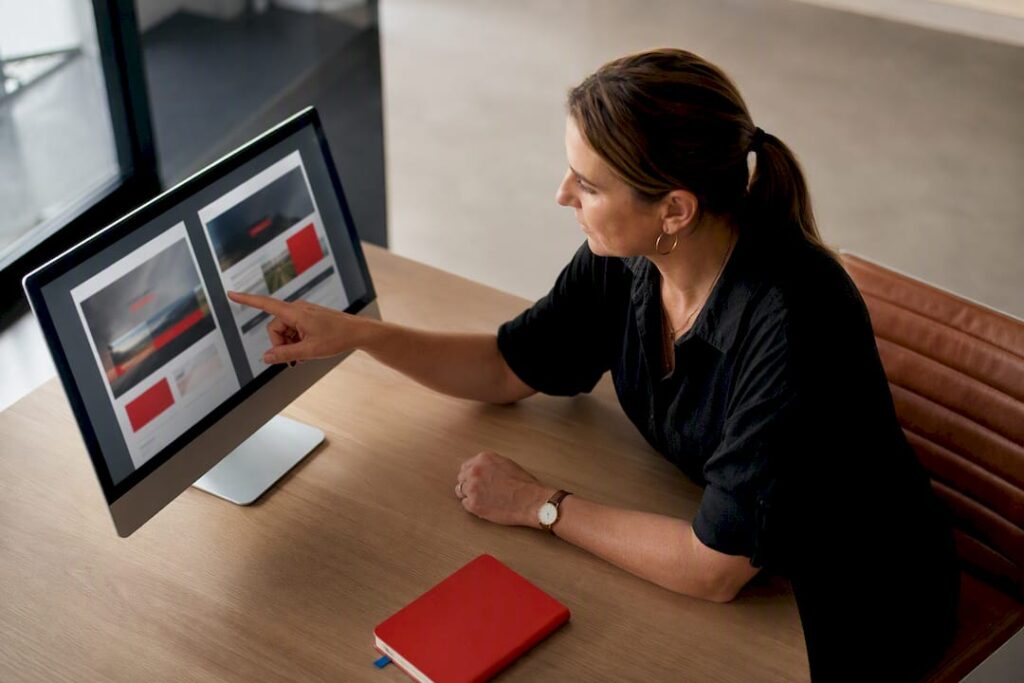 Business owner reviewing homepage hero layouts