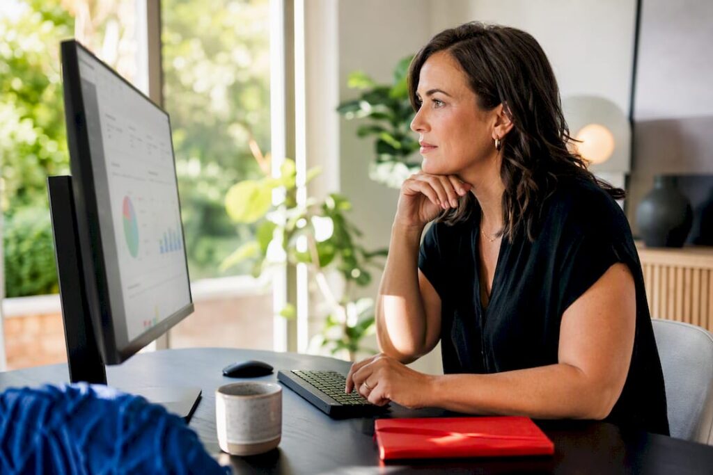 Australian business owner reviewing ad metrics