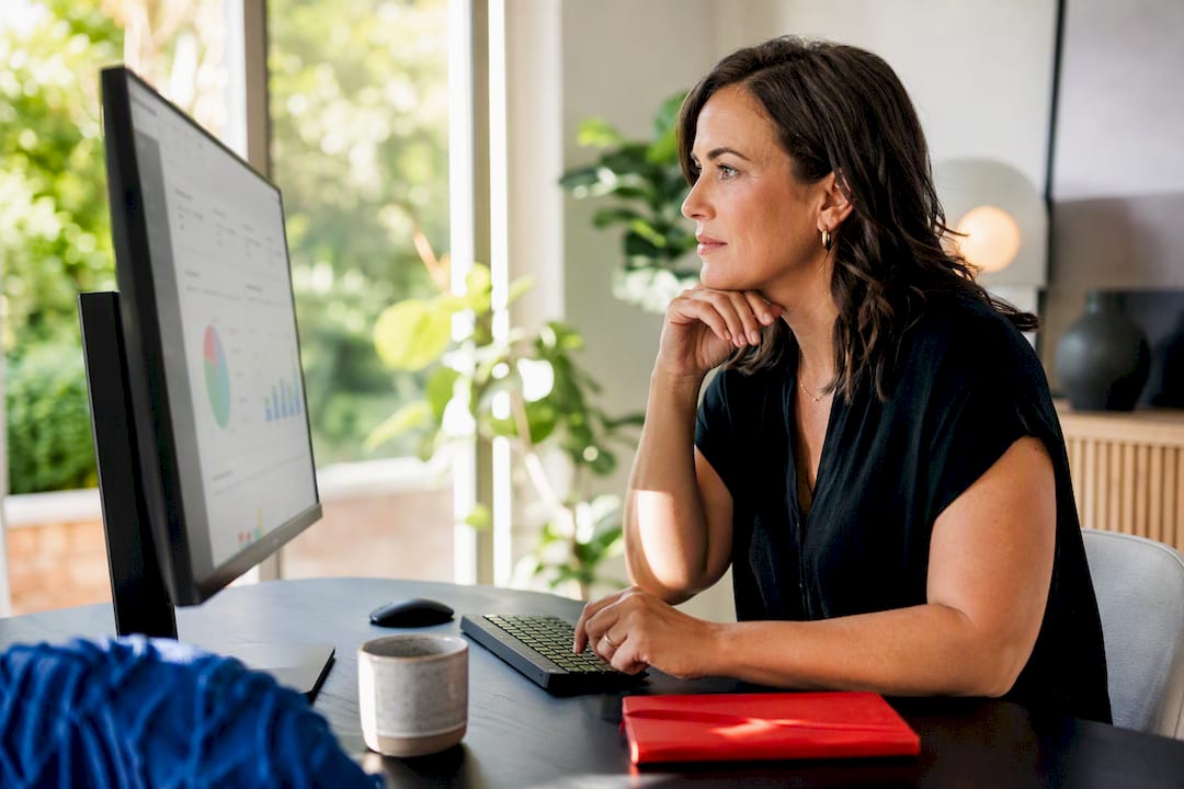 Australian business owner reviewing ad metrics