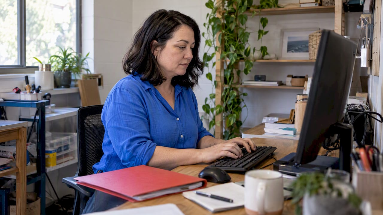 Australian business owner drafting service copy