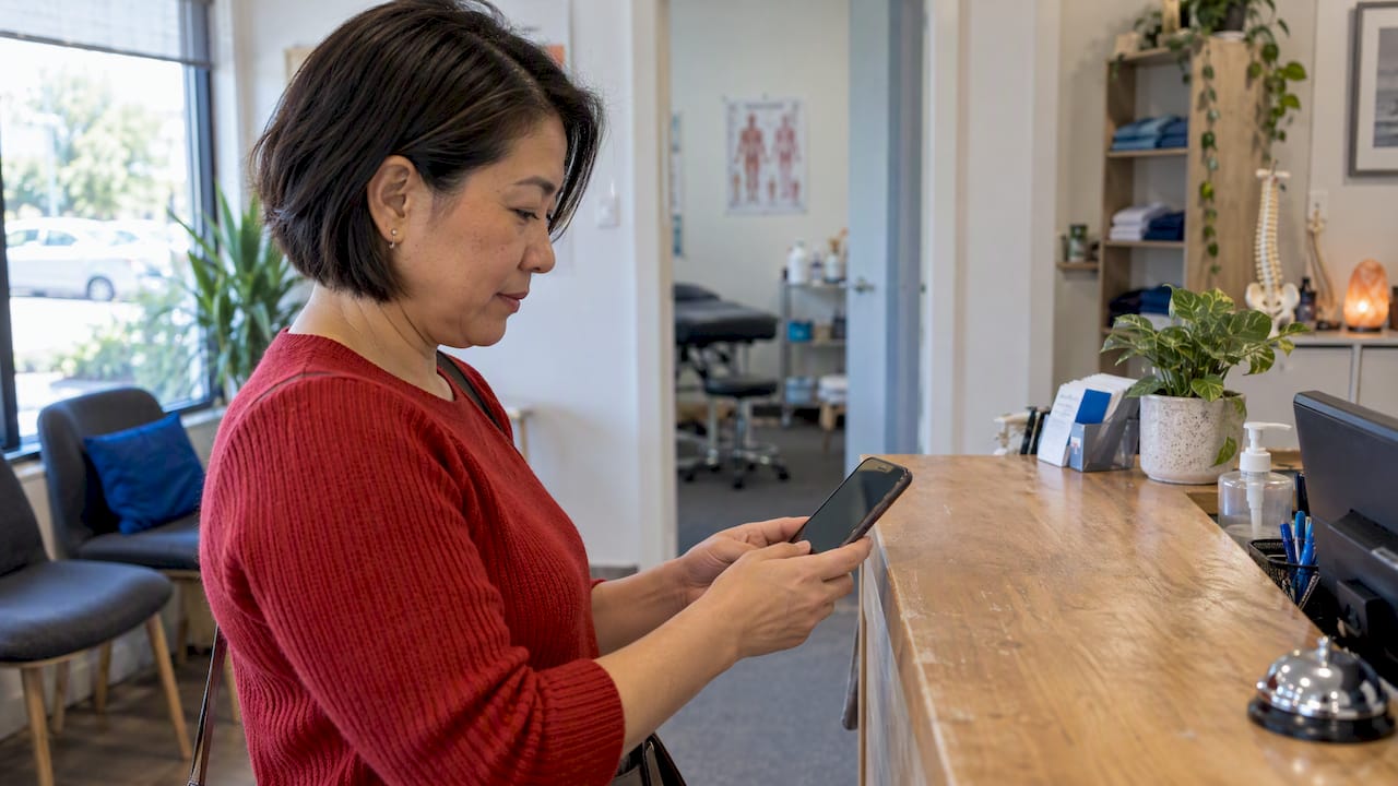 Business owner testing an enquiry form on her phone