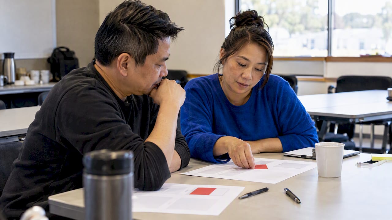 Owners comparing brand positioning in a workshop